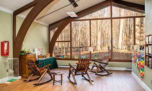 Rocking chairs await at the Whale Wallow Nature Center at Lums Pond State Park.
